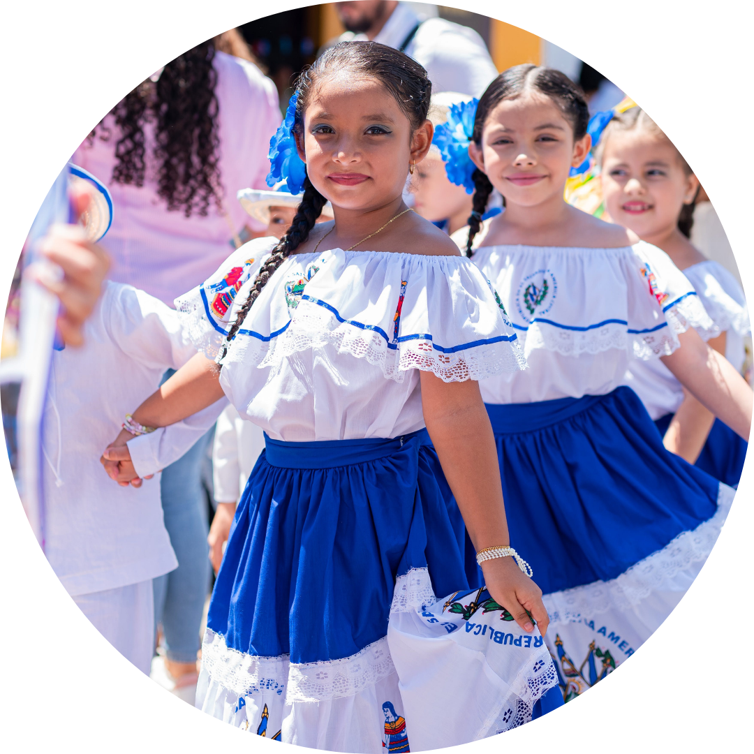  3 young girls in traditional hispanic dresses